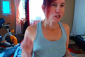 this sexy redhead is stretching in yoga