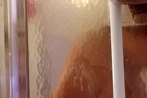 Shy milf bathes and shaves her smooth body