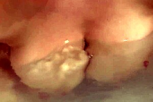 Mature tetona teases in the steamy bathroom.