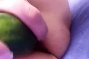 madura centroamericana enjoying a relaxing moment with a cucumber.