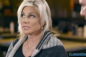 Blonde cougar with big tits relaxes