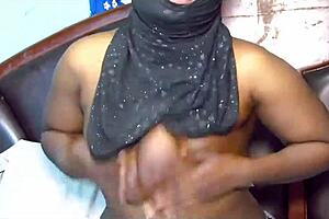 Hijab milf toys her big boobs and spreads legs