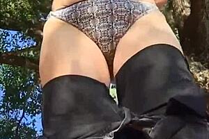 The curvy MILF babe says, 'Am I naughty masturbating my pussy outside in cute panties?'