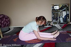 A mature European follows yoga instructions.