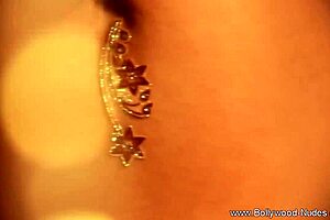 The erotic brunette milf dancer teases with striptease.