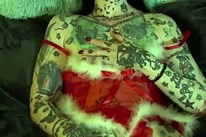 Tattooed milf with glasses and piercing achieves solo orgasm on shelf during Christmas