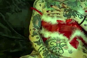 Tattooed milf with glasses and piercing achieves solo orgasm on shelf during Christmas