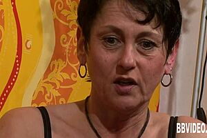 The german milf in heels starts masturbating softly on the couch