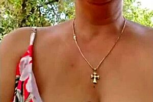 This hot blonde milf is masturbating to orgasm, showing off her natural tits in a steamy session.