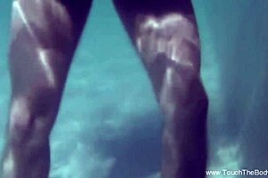 erotic massage turns sensual with hot oils, naked asian brunette dancing on bed in panties