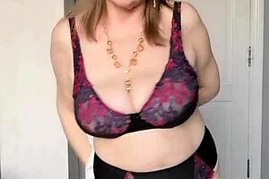 granny strips in lingerie, inviting you to explore her mature vagina