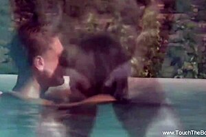 erotic massage turns sensual with hot oils, naked asian brunette dancing on bed in panties