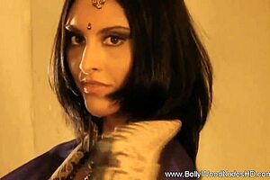 Bollywood Indian MILF dancing nude to music, ripping clothes in glamorous striptease