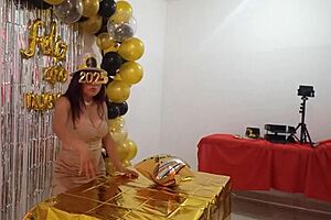 Beautiful lady hosts party in elegant dress