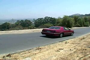 A hot redhead hitchhiker experiences rough double penetration outdoors