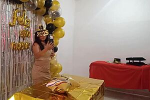 Beautiful lady hosts party in elegant dress