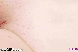 A radiant blonde beauty poses naked in a close-up photoshoot