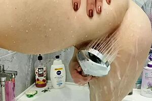 Beautiful MILF caresses her pussy with a favorite toy