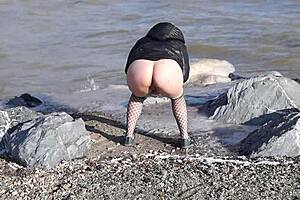 Does This Milf's Hairy Pussy Love Pissing in the Sea Outdoors?