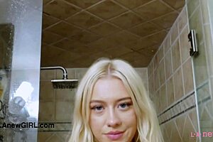 pretty blonde model takes a relaxing shower after photoshoot