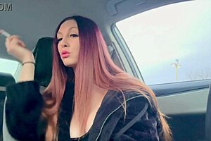 italian milf artemisia love smokes a cigarette in the car, flashing her big tits and nipple.