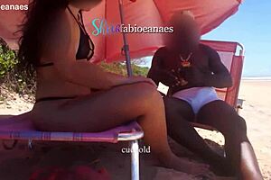 Ebony Massages Married Brunette on Public Beach Outdoors