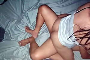 Chubby pregnant Asian mom relaxing in her bedroom