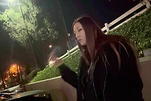 Artemisia Love smoking outdoors.