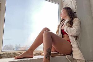 a milf seduces passers-by with public masturbation and squirting orgasms by the window