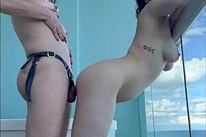 Mexican milf enjoys strap on love in Cancun