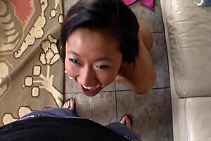 Asian mom in lingerie sucks a big cock on the bed. She bends over in heels for more action.