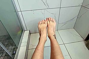 a young milf teases with her feet and toes in the shower