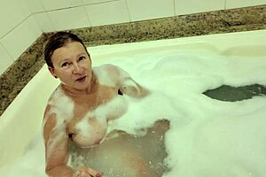 Watch me fuck this 58-year-old MILF hard in the foamy jacuzzi!
