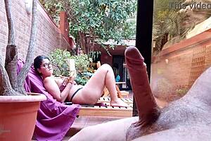 my stepson takes out his big cock on the terrace gets excited looking at me behind the window and showing his erection to the neighbors my nipples are very hard and im not wearing a bra