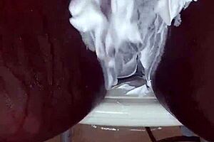 Black MILF shaves pussy on camera