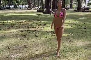 monika fox poses beautifully in a pink bikini on the beach