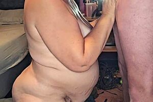 The pregnant milf eagerly sucks a huge cock.