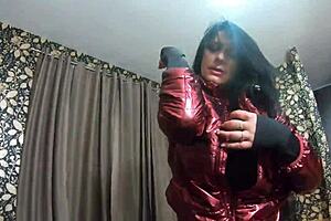 Nympho wife plays with camel-toe jumpsuit, adds cum to shiny red down-jacket.