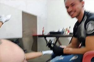 Talking about getting a tattoo while using a subtle accessory in place