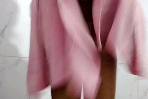 Desi teen pissing indoors while bathing?