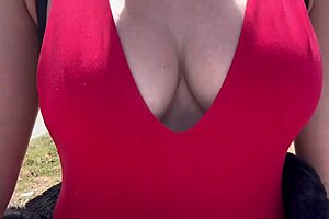 hot horny milf walks outdoor with big boobs on display