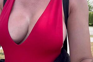 hot horny milf walks outdoor with big boobs on display