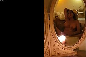 Masturbating in vintage mirrors while chatting casually.