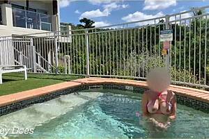 A daring wife flashes her boobs in the hotel pool during an exhibitionist adventure.