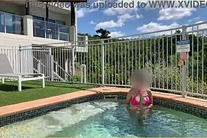 A daring wife flashes her boobs in the hotel pool during an exhibitionist adventure.