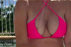 A daring wife flashes her boobs in the hotel pool during an exhibitionist adventure.