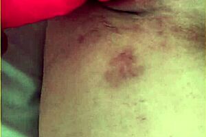 My wifey is pushing her big 10 inch dildo into her shaved pussy