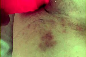 My wifey is pushing her big 10 inch dildo into her shaved pussy