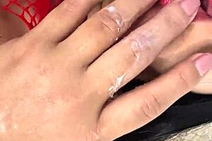 A masked cheating wife secretly masturbates for her lover, wetting her tight pussy completely.