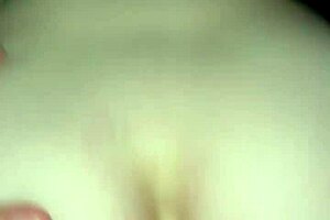 In the bedroom, a milf rides reverse cowgirl, leading to a creampie with her amateur partner